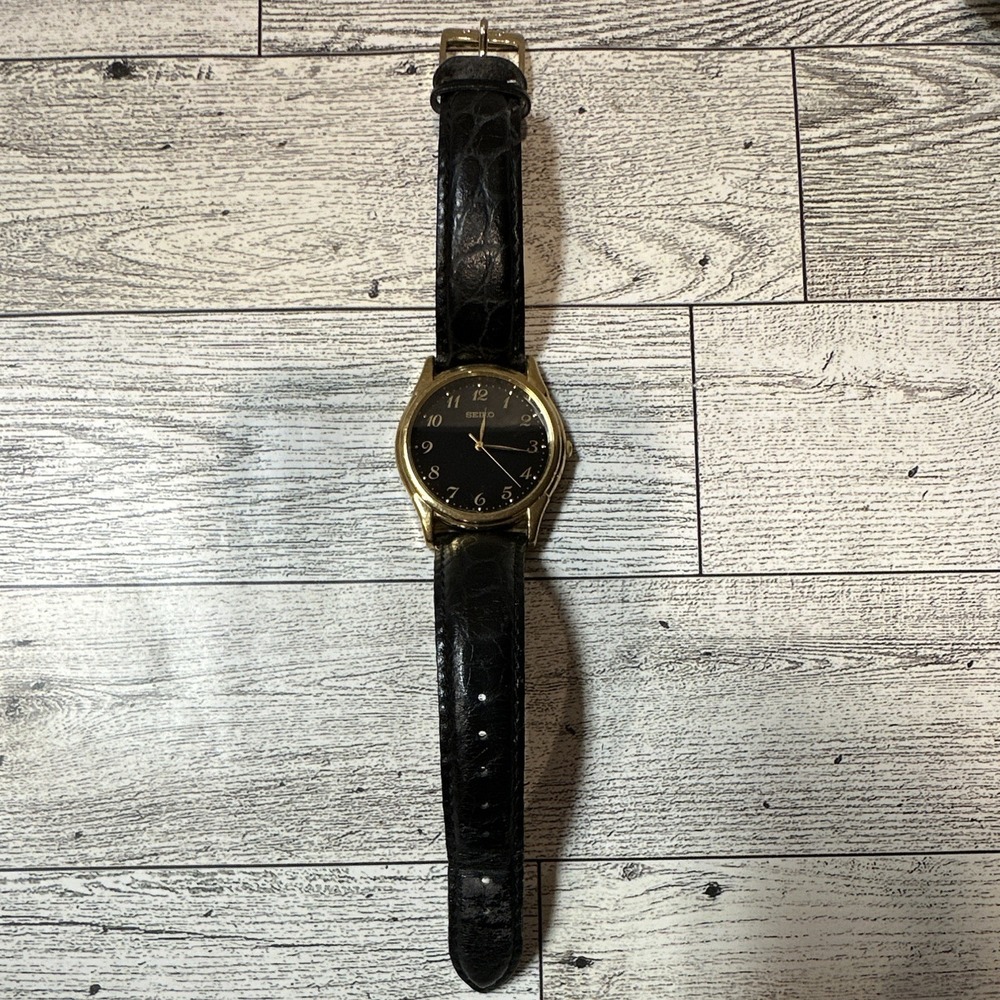 Seiko Vintage V701-1920 Unisex Black Dial Arabic Quartz WR Gold Leather *Untest
